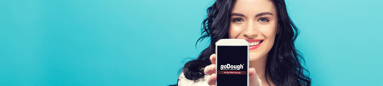 Cute brunette holding phone with goDough logo