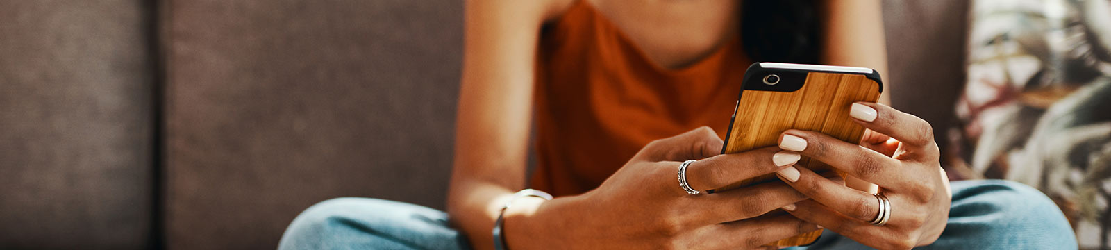 A woman holding a smartphone