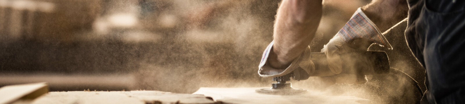 A person sanding wood