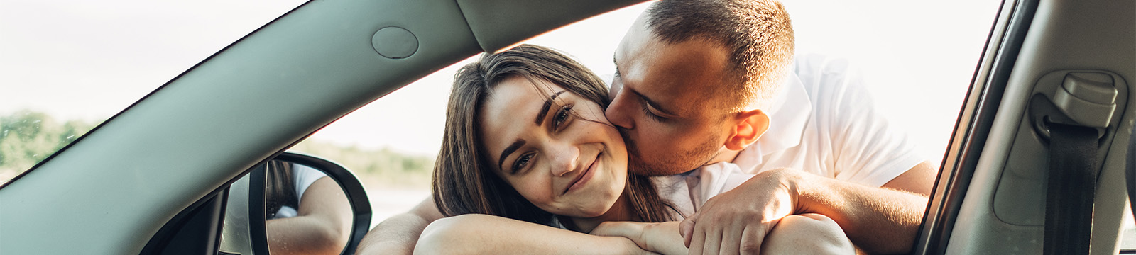 Happy couple with new car